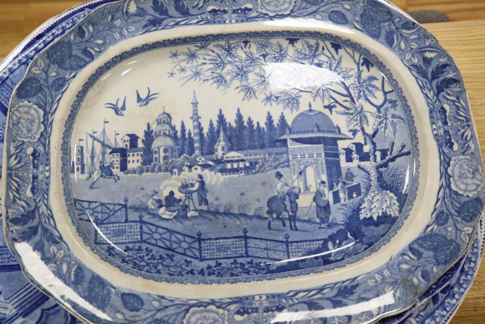 A collection of 19th / 20th century blue and white pottery including meat platters, dishes, bowls, etc.